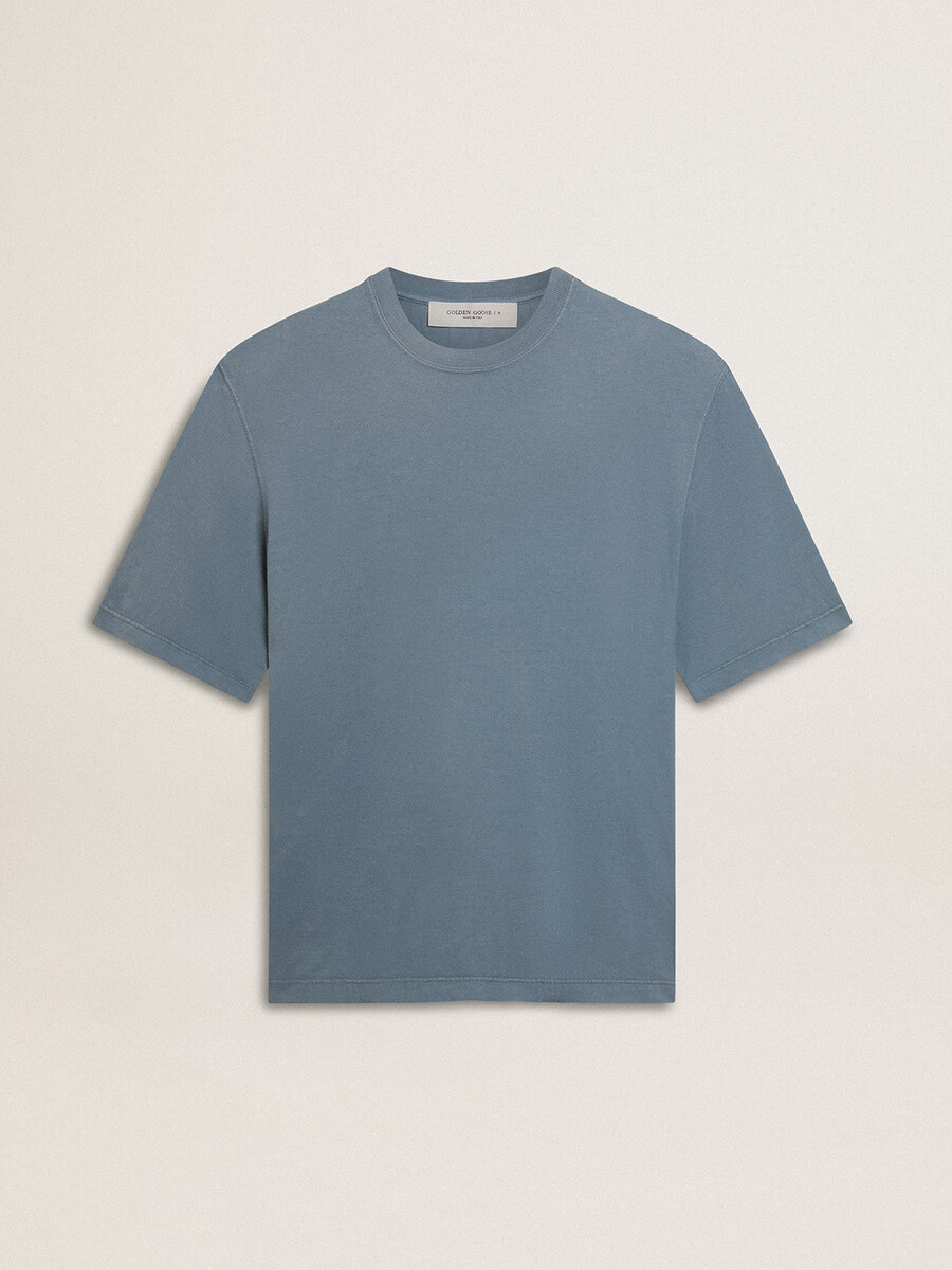 背面にリバースプリントが施されたベビーブルーのユニセックスコットンtシャツ