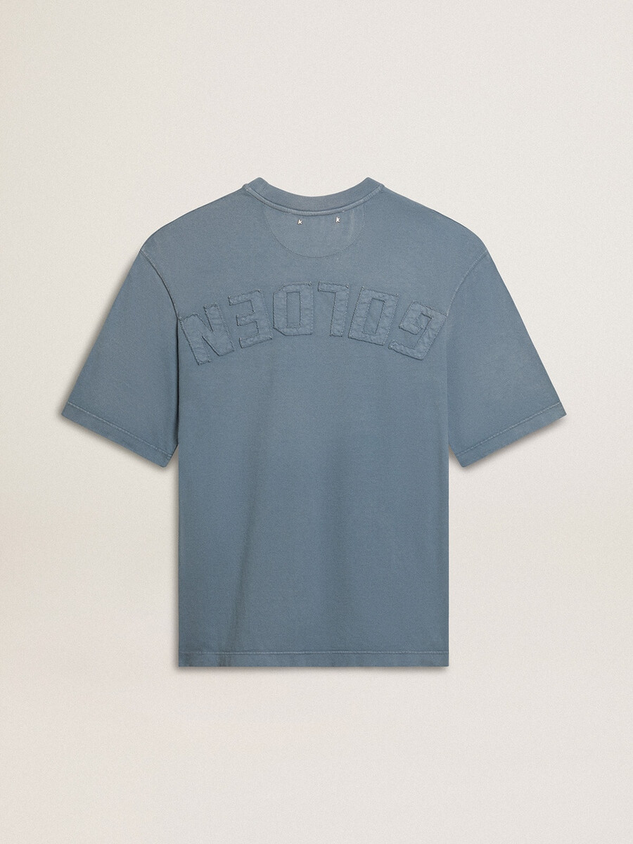 背面にリバースプリントが施されたベビーブルーのユニセックスコットンtシャツ